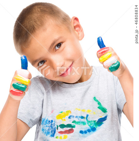 Portrait of a cute boy playing with paints 46808834