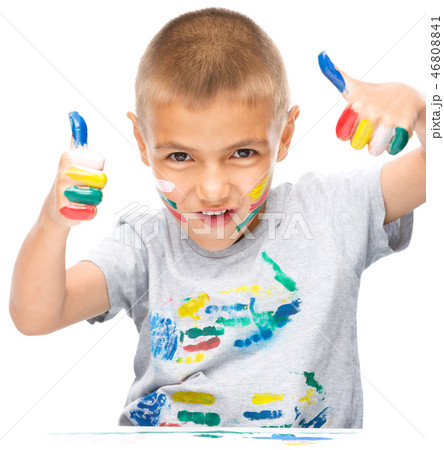 Portrait of a cute boy playing with paints 46808841