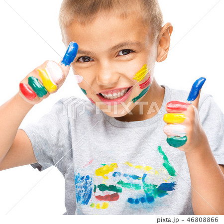 Portrait of a cute boy playing with paints Portrait of a cute boy playing with paints 46808866