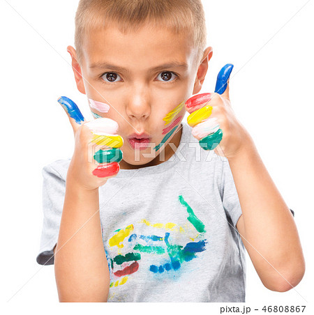 Portrait of a cute boy playing with paints Portrait of a cute boy playing with paints 46808867