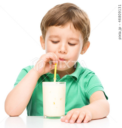 Cute little boy with a glass of milk Cute little boy with a glass of milk 46809131