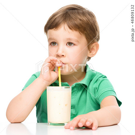 Cute little boy with a glass of milk Cute little boy with a glass of milk 46809132