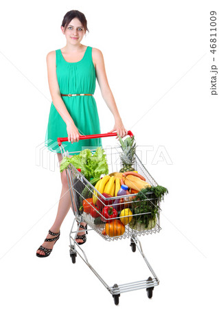 woman in green dress with shopping grocery cart woman in green dress with shopping grocery cart 46811009
