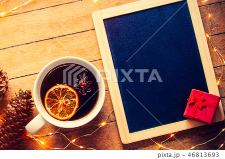 Cup of tea with lemon and star anise with Christmas lights  46813693