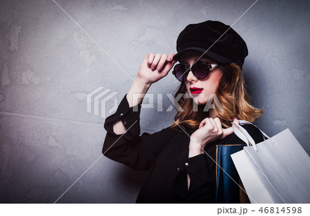 Style redhead girl in hat with shopping bags and sunglasses 46814598