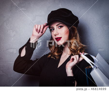 Style redhead girl in hat with shopping bags 46814699