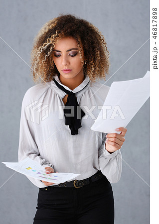 Beautiful black woman portrait. Holds paper documents Beautiful black woman portrait. Holds paper documents 46817898