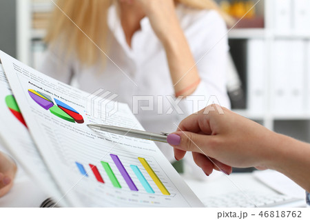 Group of people deliberate on problem with clipboard Group of people deliberate on problem with clipboard 46818762
