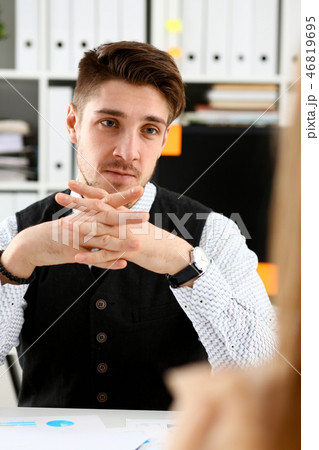 Handsome man in suit offer contract form Handsome man in suit offer contract form 46819695