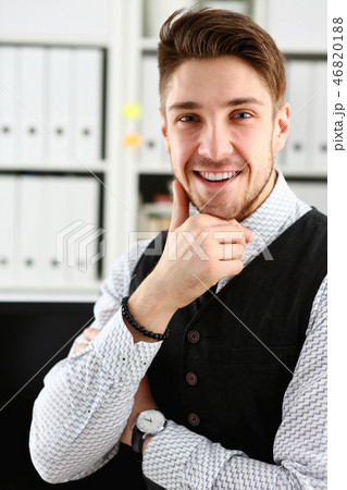 Handsome man in suit and tie stand in office Handsome man in suit and tie stand in office 46820188