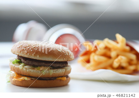 Hamburger and french fries with headphones Hamburger and french fries with headphones 46821142