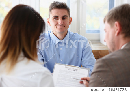 Businessman in blue shirt offer contract form on clipboard Businessman in blue shirt offer contract form on clipboard 46821728