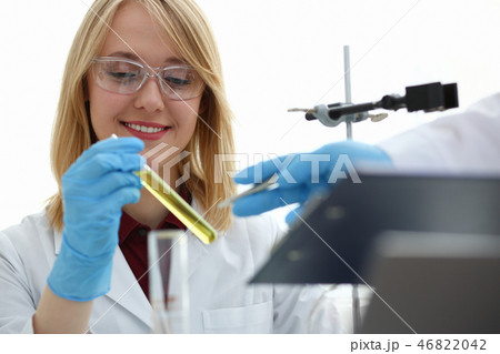 Technician hold in arms in protective gloves Technician hold in arms in protective gloves 46822042