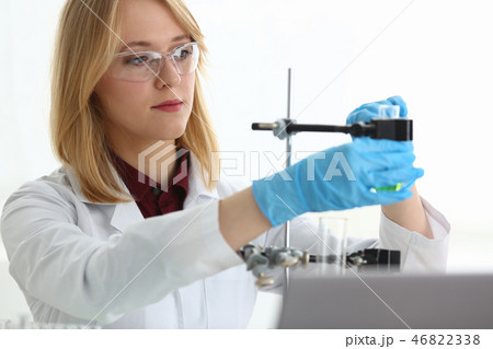Technician hold in arms in protective gloves Technician hold in arms in protective gloves 46822338