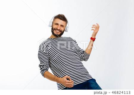 Delighted happy man playing his favourite song 46824113