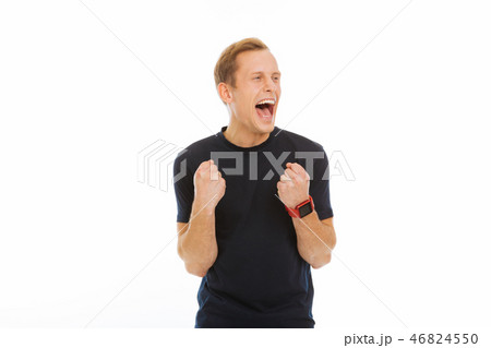 Joyful delighted man expressing his positive emotions 46824550