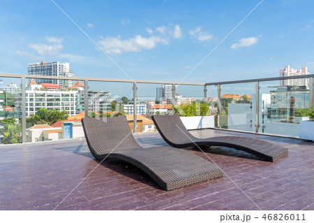 Sun loungers are located on the rooftop. 46826011