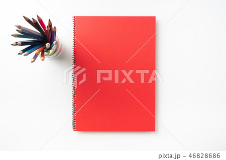 Top view of red spiral notebook, page, pencil Top view of red spiral notebook, page, pencil 46828686
