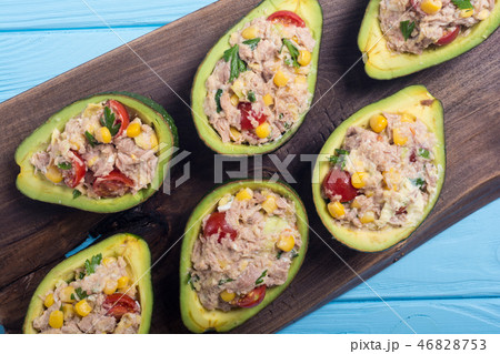 Avocado stuffed with salad 46828753
