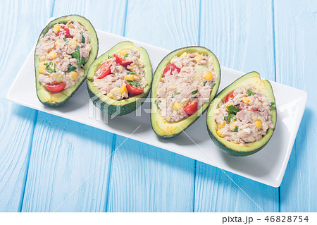Avocado stuffed with salad 46828754