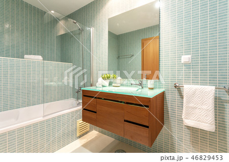 Modern bathroom with shower and washbasin for hygiene. Modern bathroom with shower and washbasin for hygiene. 46829453