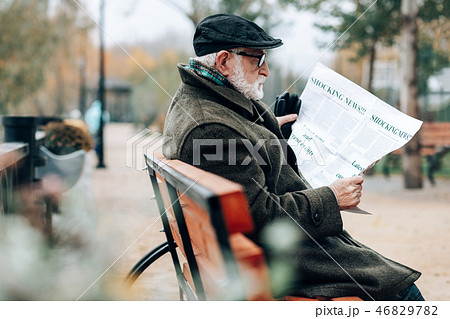 Profile photo of serious pensioner that reading article Profile photo of serious pensioner that reading article 46829782