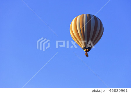 Flying a beautiful balloon in the blue sky closeup 46829961