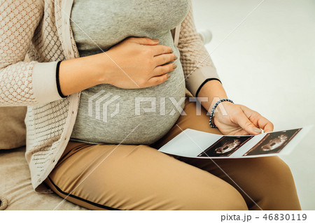 Pregnant woman receiving her ultrasound results on baby sex Pregnant woman receiving her ultrasound results on baby sex 46830119
