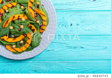 Autumn salad pumpkin spinach pomegranate chickpea 46830743