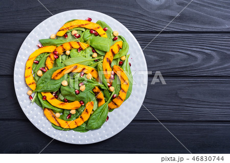Autumn salad pumpkin spinach pomegranate chickpea 46830744