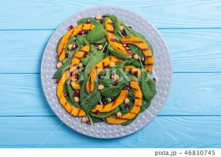 Autumn salad pumpkin spinach pomegranate chickpea 46830745