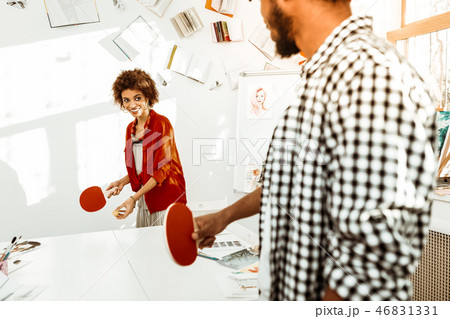 Creative artists having some rest while playing table tennis 46831331