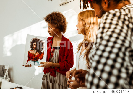 Man and woman looking at nice beautiful portrait of their friend 46831513