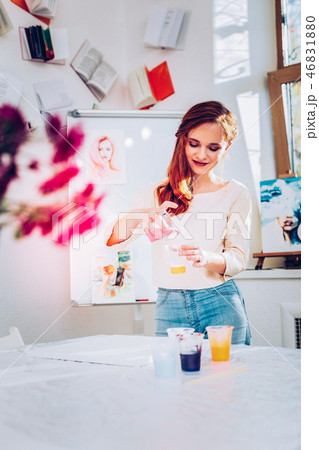 Promising creative artist standing in her painting studio 46831880