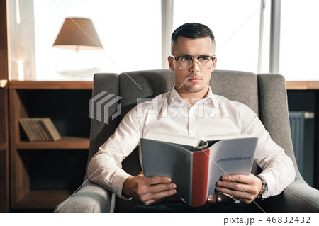 Smart promising lawyer reading the administrative law Smart promising lawyer reading the administrative law 46832432