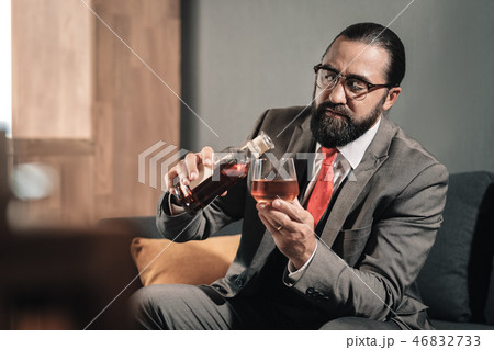 Man suffering from nervous breakdown continuing drinking whisky Man suffering from nervous breakdown continuing drinking whisky 46832733