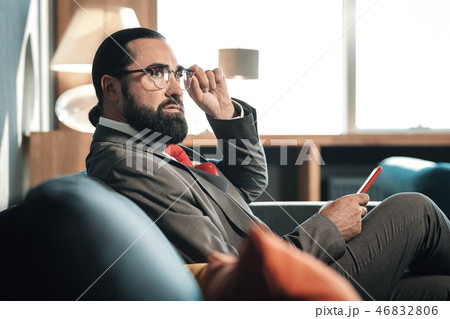 Stylish bearded man wearing nice business attire and red tie 46832806