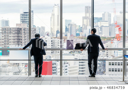 businessman stand on window in Tokyo, Japan 46834759