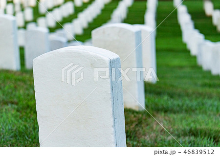 Grave stones on a peaceful cemetery. 46839512
