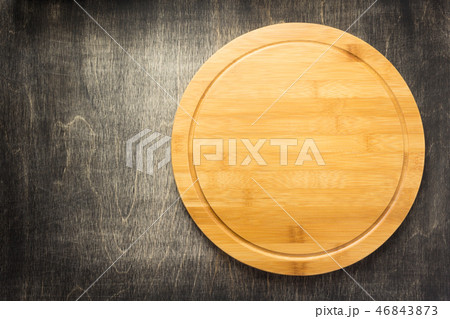 cutting board at old wooden table cutting board at old wooden table 46843873