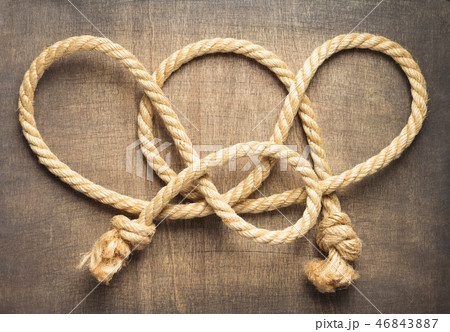 ship rope at wooden background 46843887