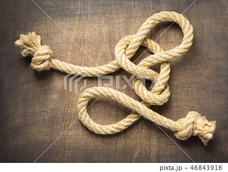 ship rope at wooden background surface ship rope at wooden background surface 46843916