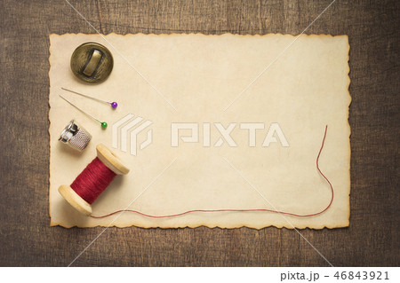 sewing tools and accessories on wood 46843921