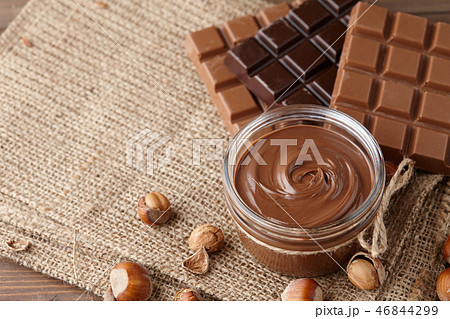 Chocolate spread with hazelnuts on sack background 46844299