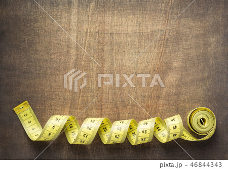 tape measure on slate stone background 46844343