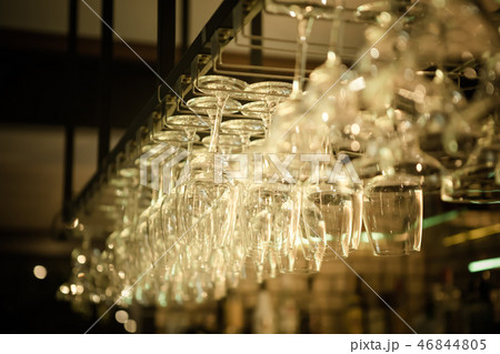 a row of hanging wine glass a row of hanging wine glass 46844805