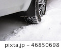 Close up of a cars tires on a snowy road 46850698