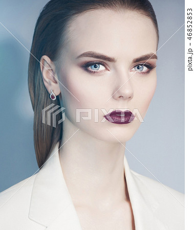 Elegant woman in white jacket Elegant woman in white jacket 46852853