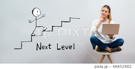 Next level concept with young woman using her laptop  46852902