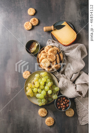 Cheese and grapes appetizer 46854112